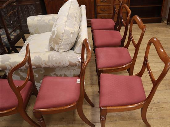 A set of six Victorian mahogany buckle-back dining chairs with drop-in seats